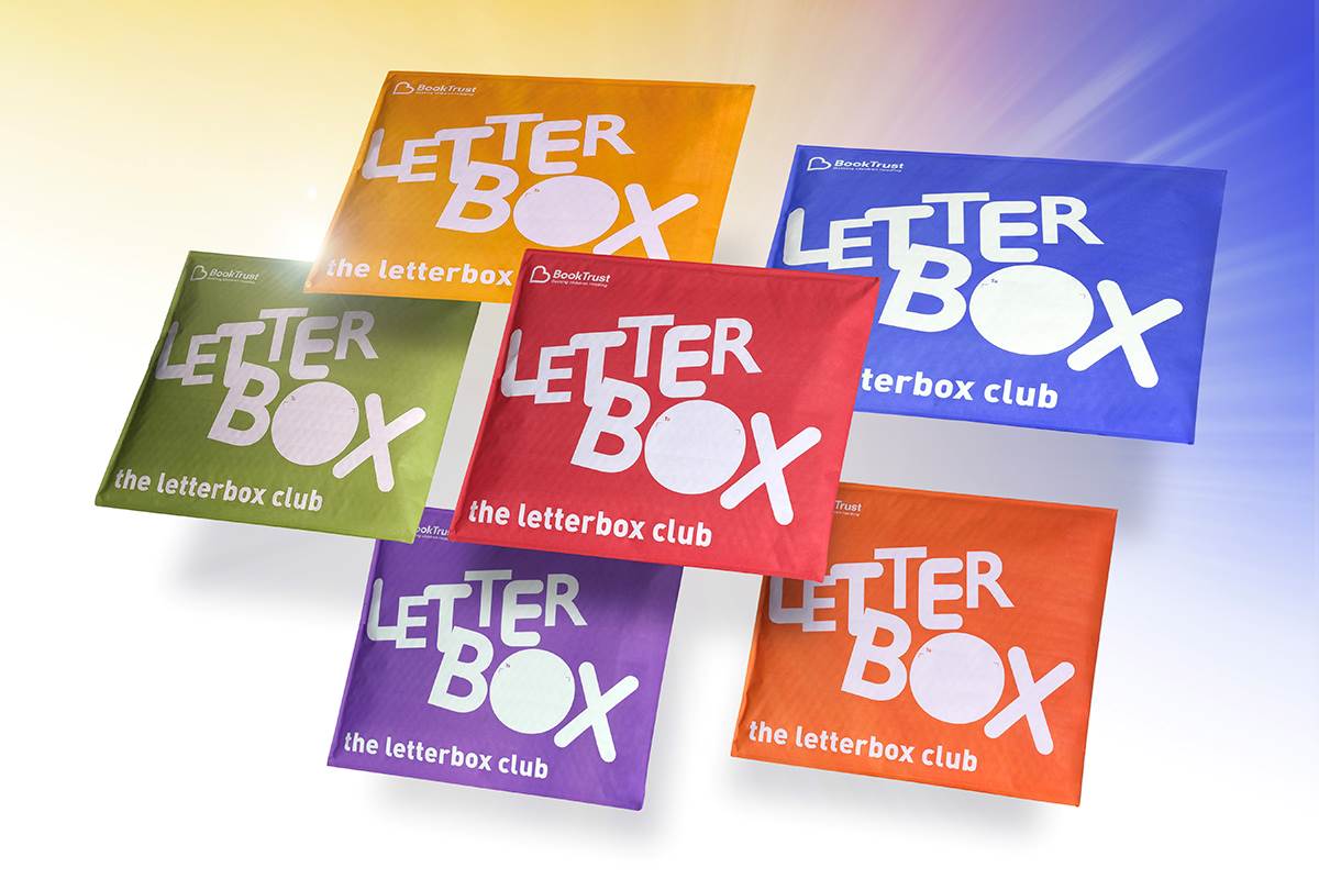 A photo of different coloured Letterbox Club envelopes