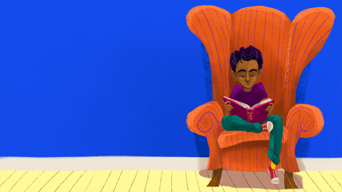 A boy reading in a chair