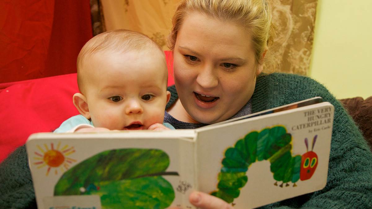 baby and mum reading Hungry Caterpillar