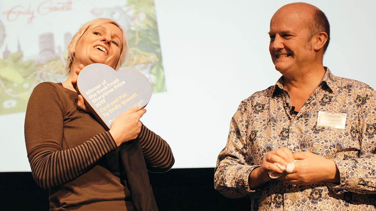 Emily Gravett receives the Storytime Prize award from Paul Howard-Jones