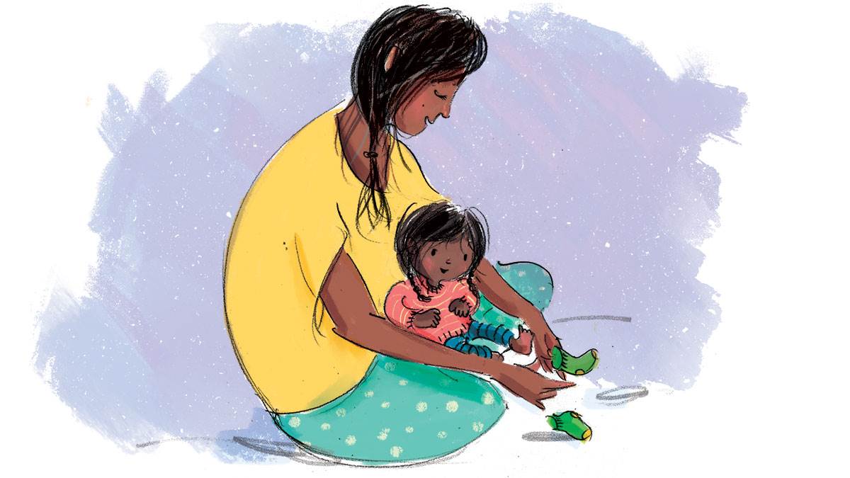 An illustration of a woman putting socks on her baby.