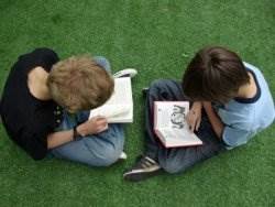 Boys reading outside