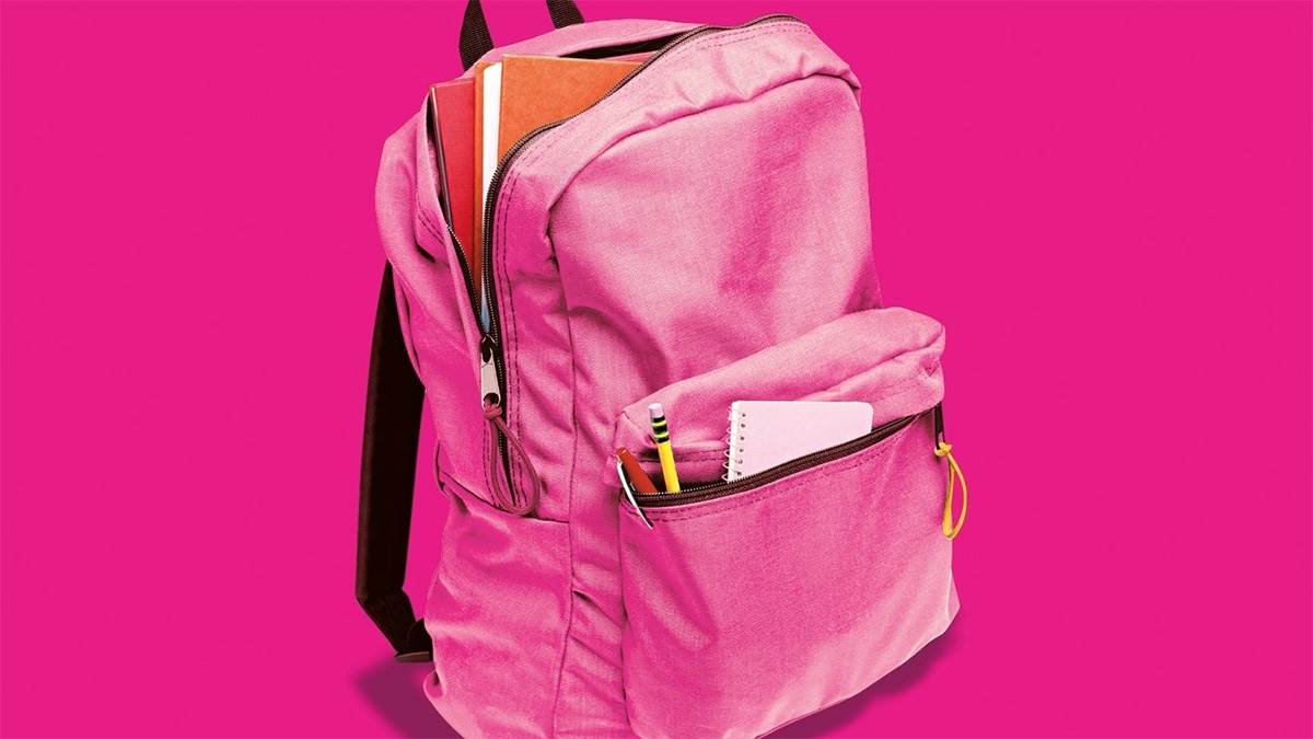 A photo of a backpack with pencils and notebooks in it from the front cover of Are You There God It's Me Margaret