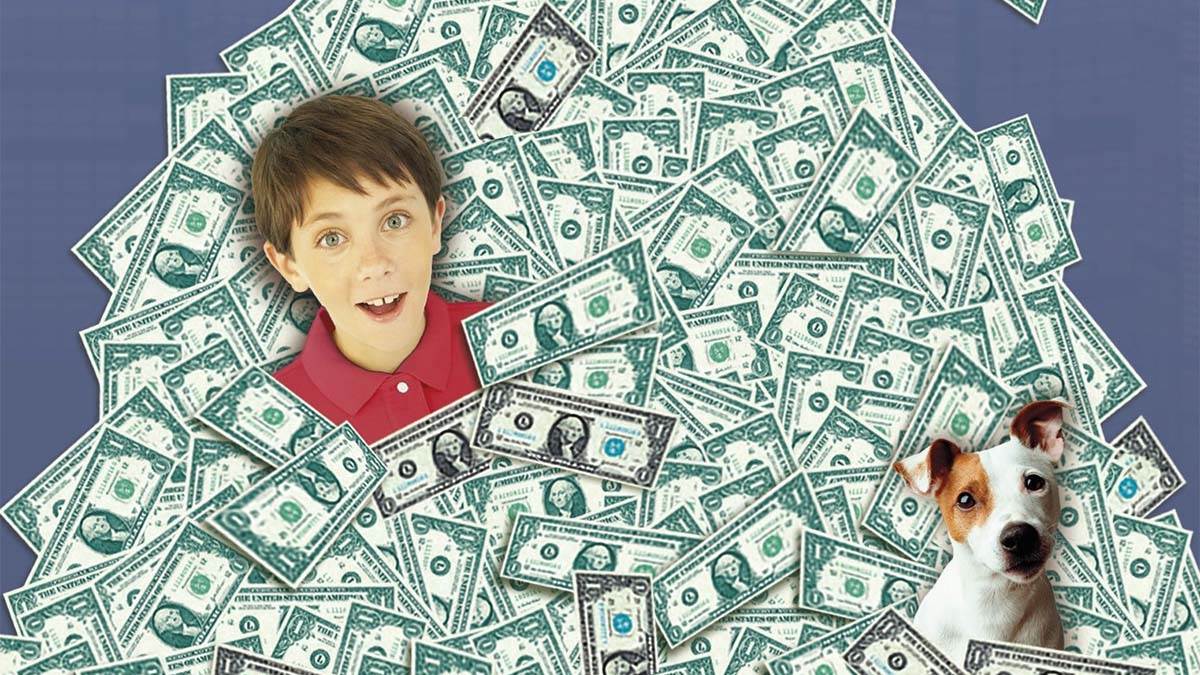 An image from the front cover of Too Small to Fail - a huge pile of bank notes, with a boy's head and a dog's head sticking out from it 