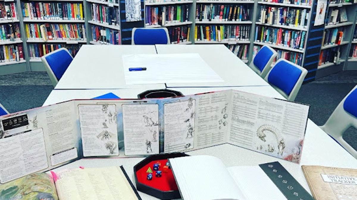 A game of Dungeons and Dragons set up in a school library