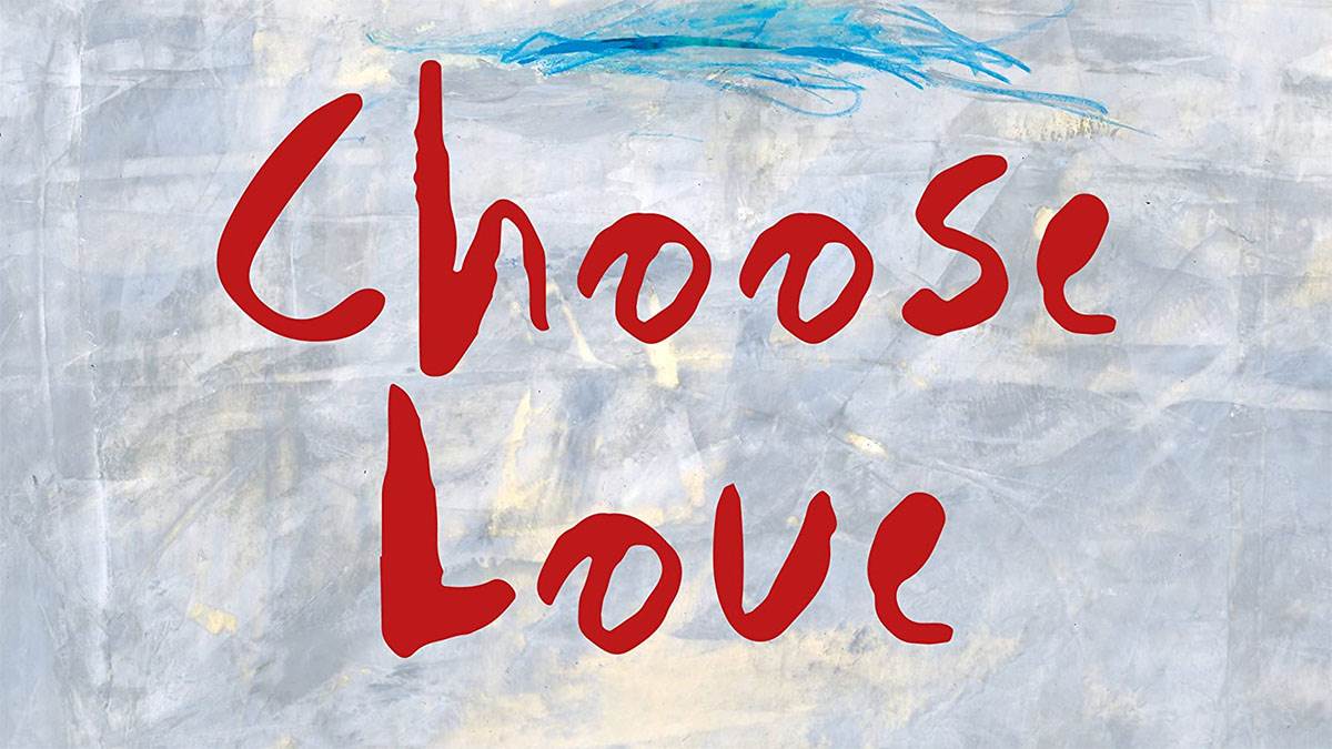 A section of the front cover of Choose Love, featuring the words 'Choose Love' on a backdrop of crinkled paper