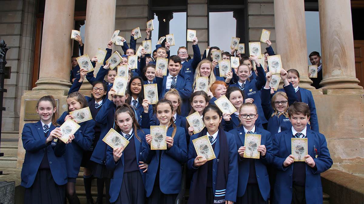 Pupils with their books at the Titanic book event in Belfast