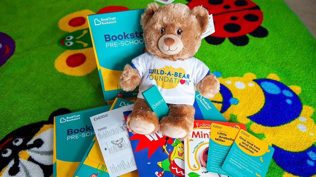 A Build-a-Bear Foundation bear with the contents of Bookstart packs