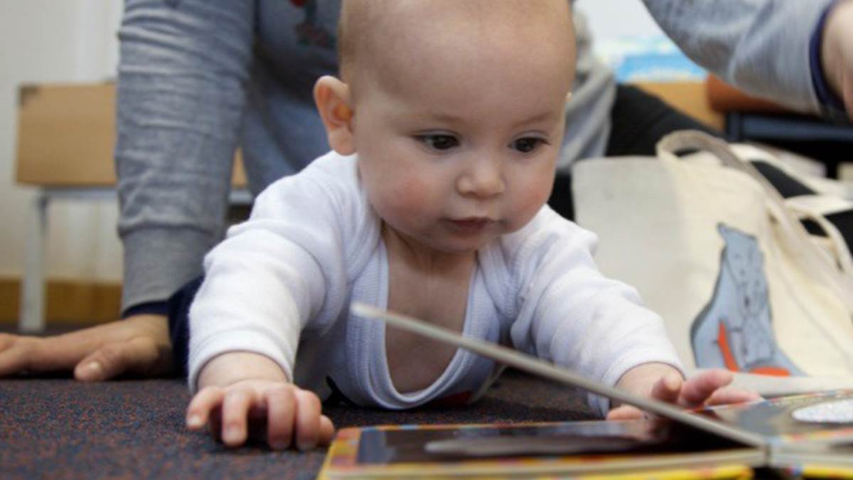 Crawling baby with book