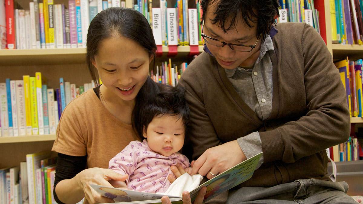 Mum, dad and baby at library
