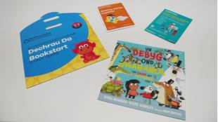 The Bookstart Early Years  pack, including an envelope, information  booklet, library leafllet and a bilingual copy of  The Same But Different Too