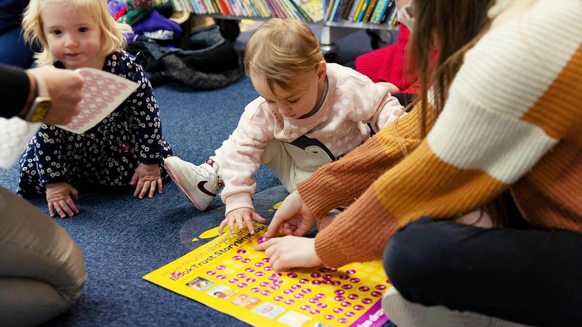 Children voting for their favourite books at a BookTrust Storytime event
