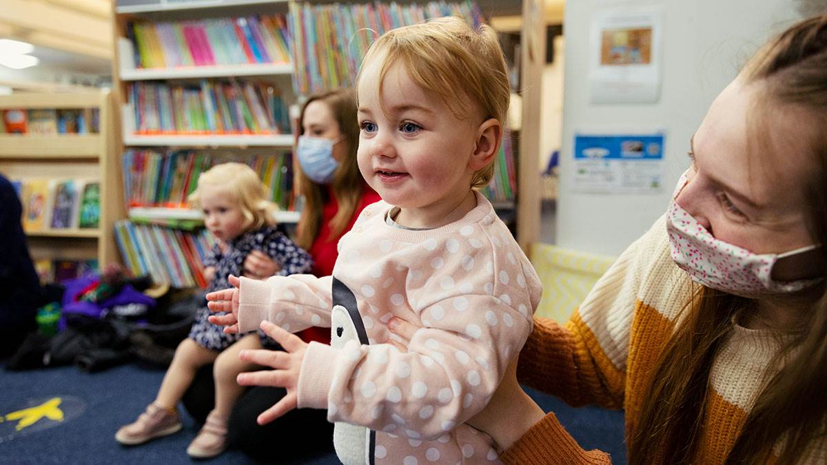A child clapping at a BookTrust Storytime session